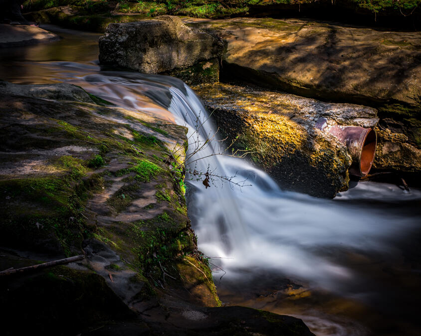 Untitled Flowing water in a river bed in Northeast Ohio.