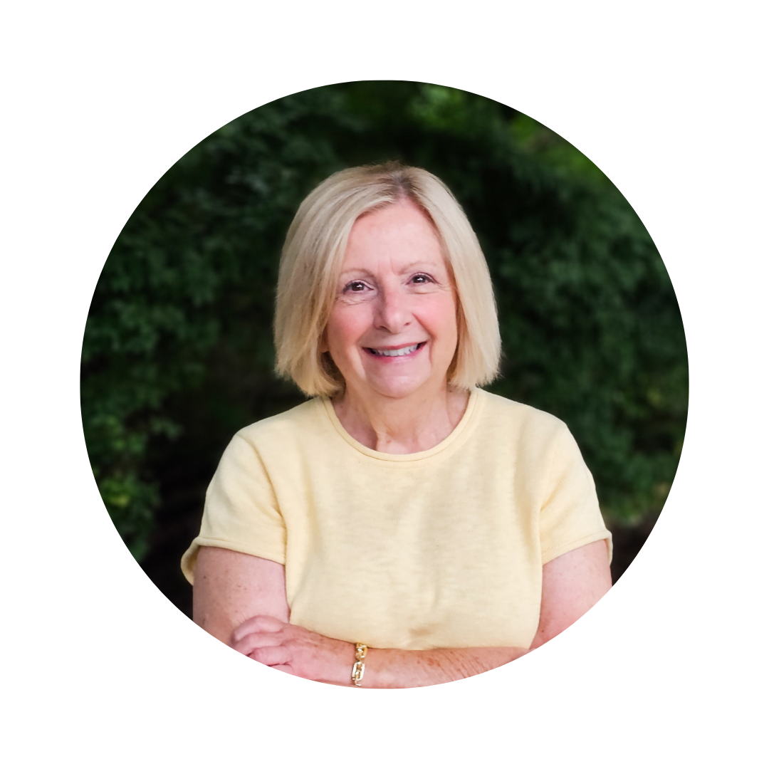 Kathy Archer, Northeast Ohio real estate agent with Limitless Real Estate Group, smiling outdoors in a yellow shirt.